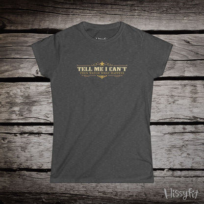 Gray t-shirt with text 'Tell me I can't then watch what happens' on a wooden surface, featuring the brand 'Hissyfit'.
