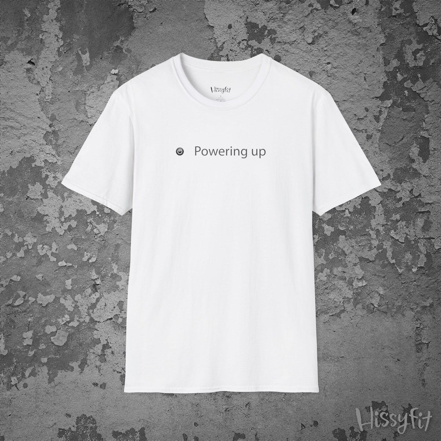 White t-shirt with 'Powering up' text on a textured gray background