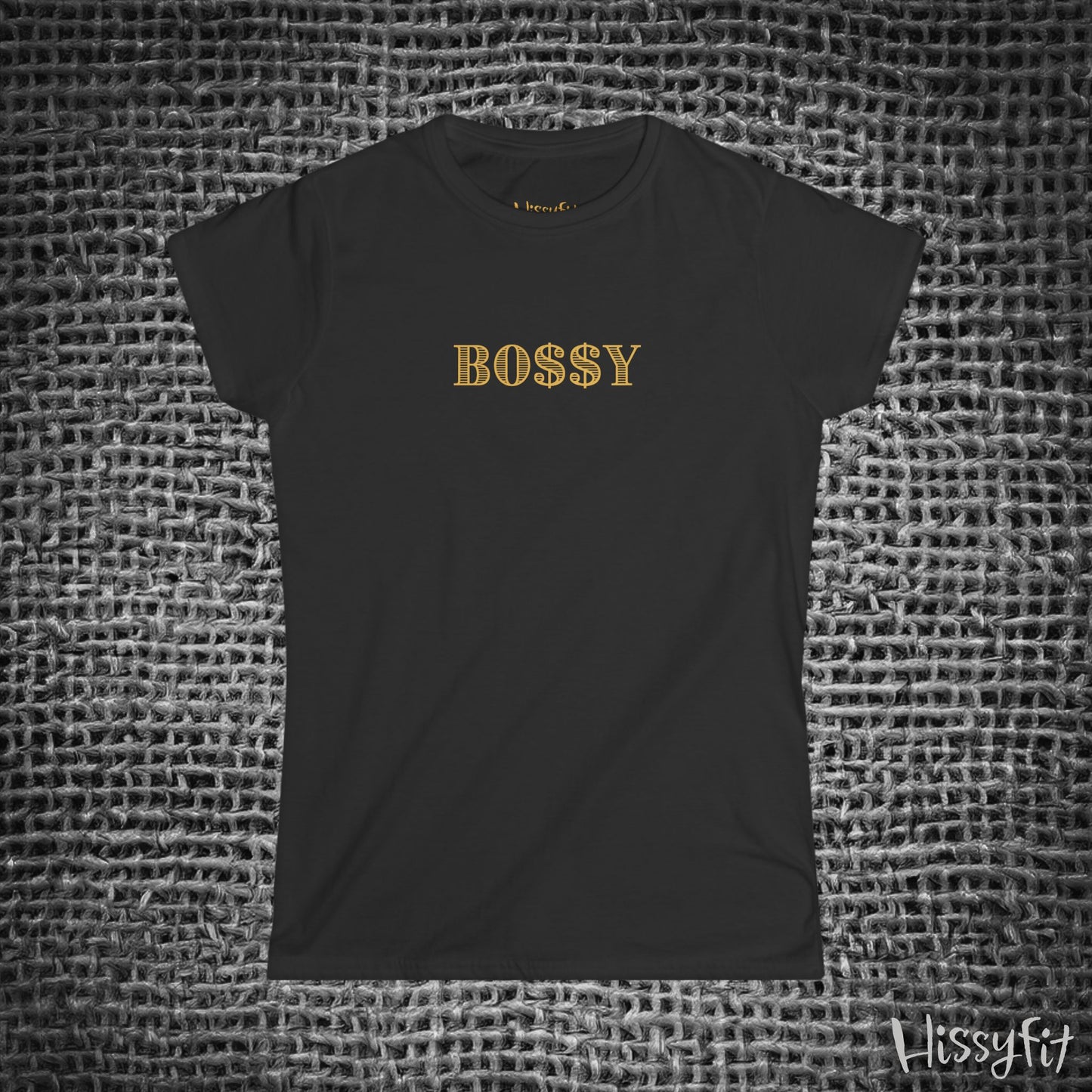 Black t-shirt with 'BOSSY' in gold on a textured gray background