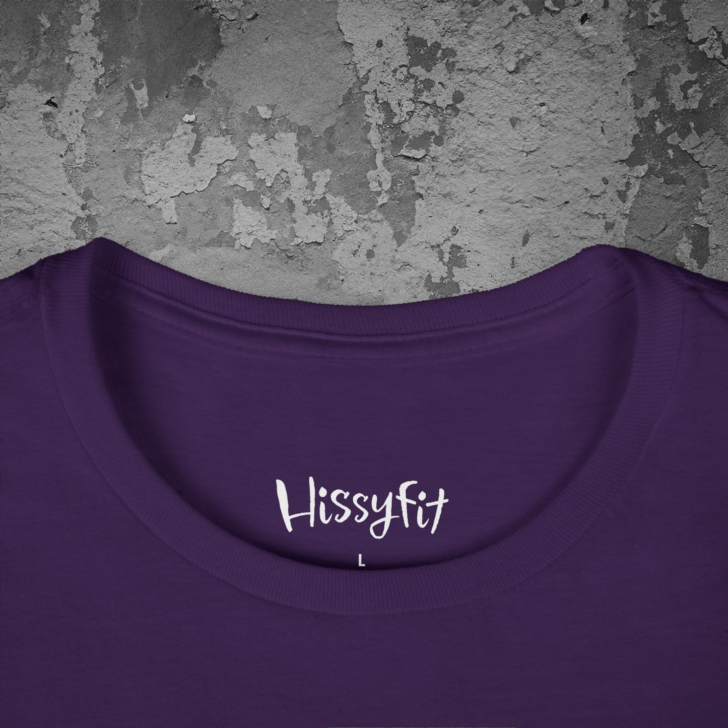 Purple shirt with 'Hissyfit' text on a textured gray background