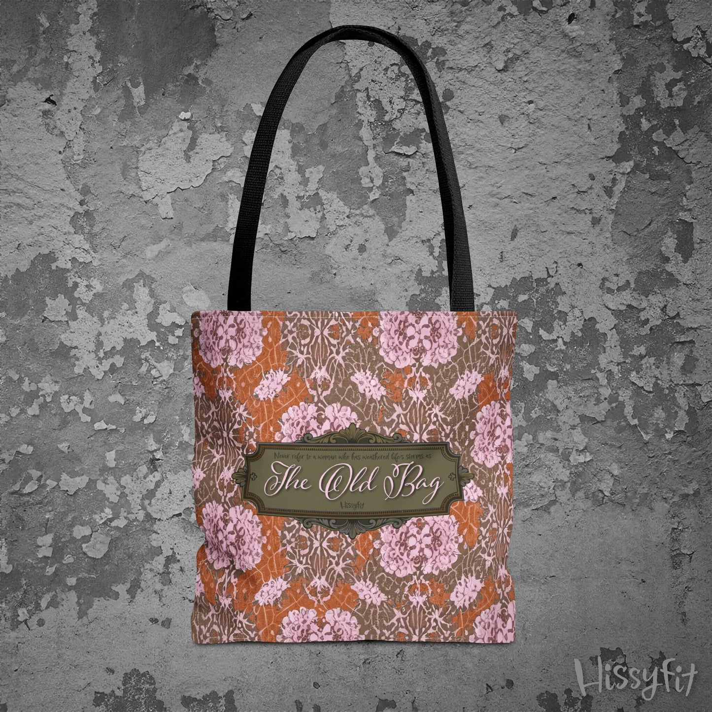 Floral patterned bag with 'The Old Bag' label on a textured gray background