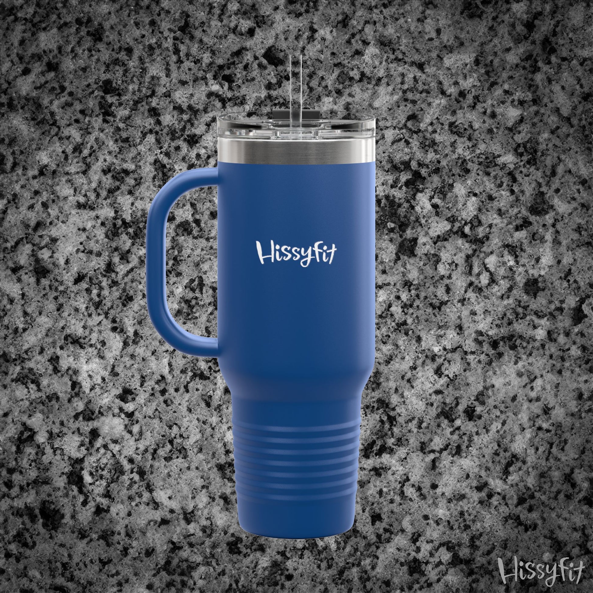 Blue travel mug with handle on a gray granite surface, featuring the brand 'Hissyfit'.