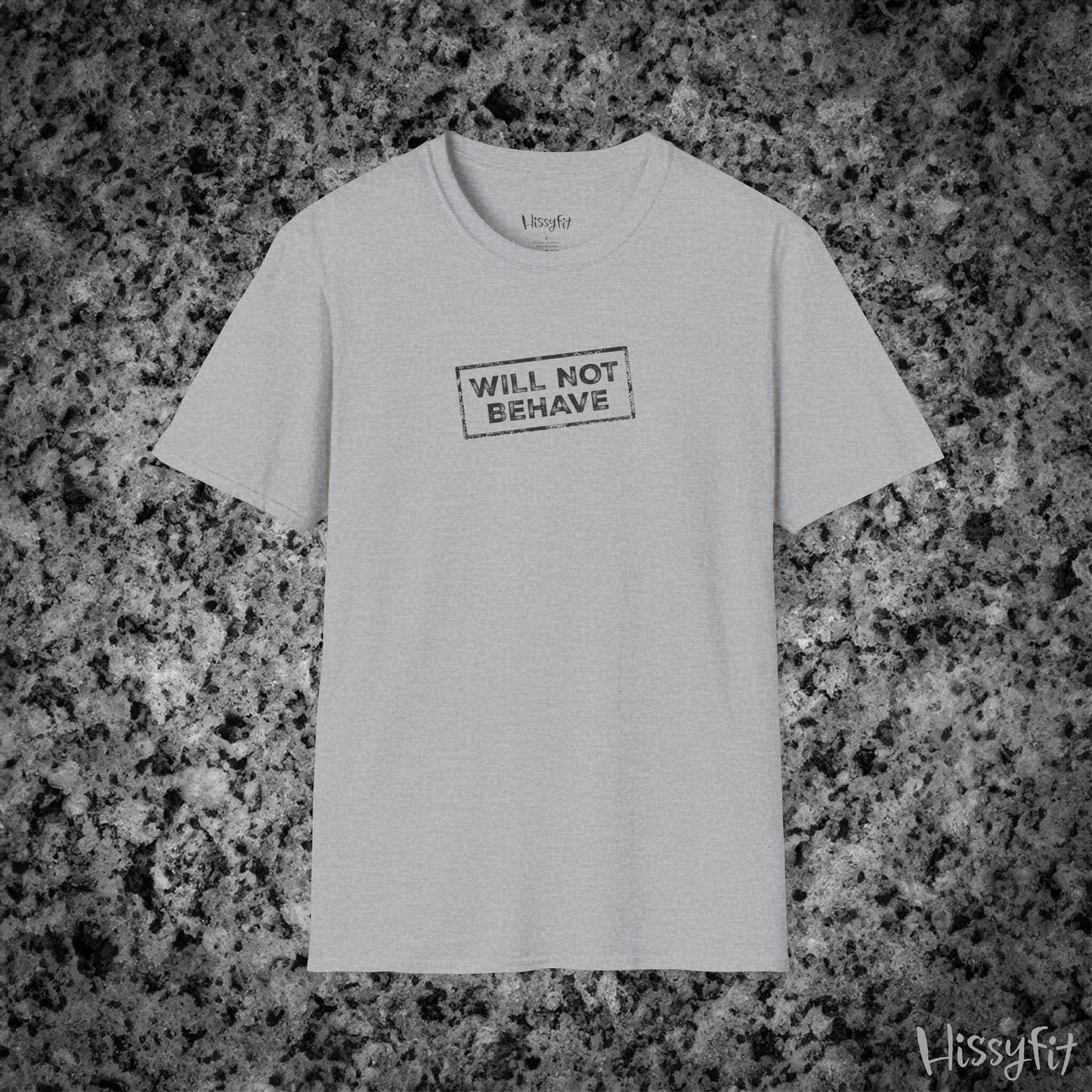 Gray t-shirt with 'WILL NOT BEHAVE' text on a gray granite background