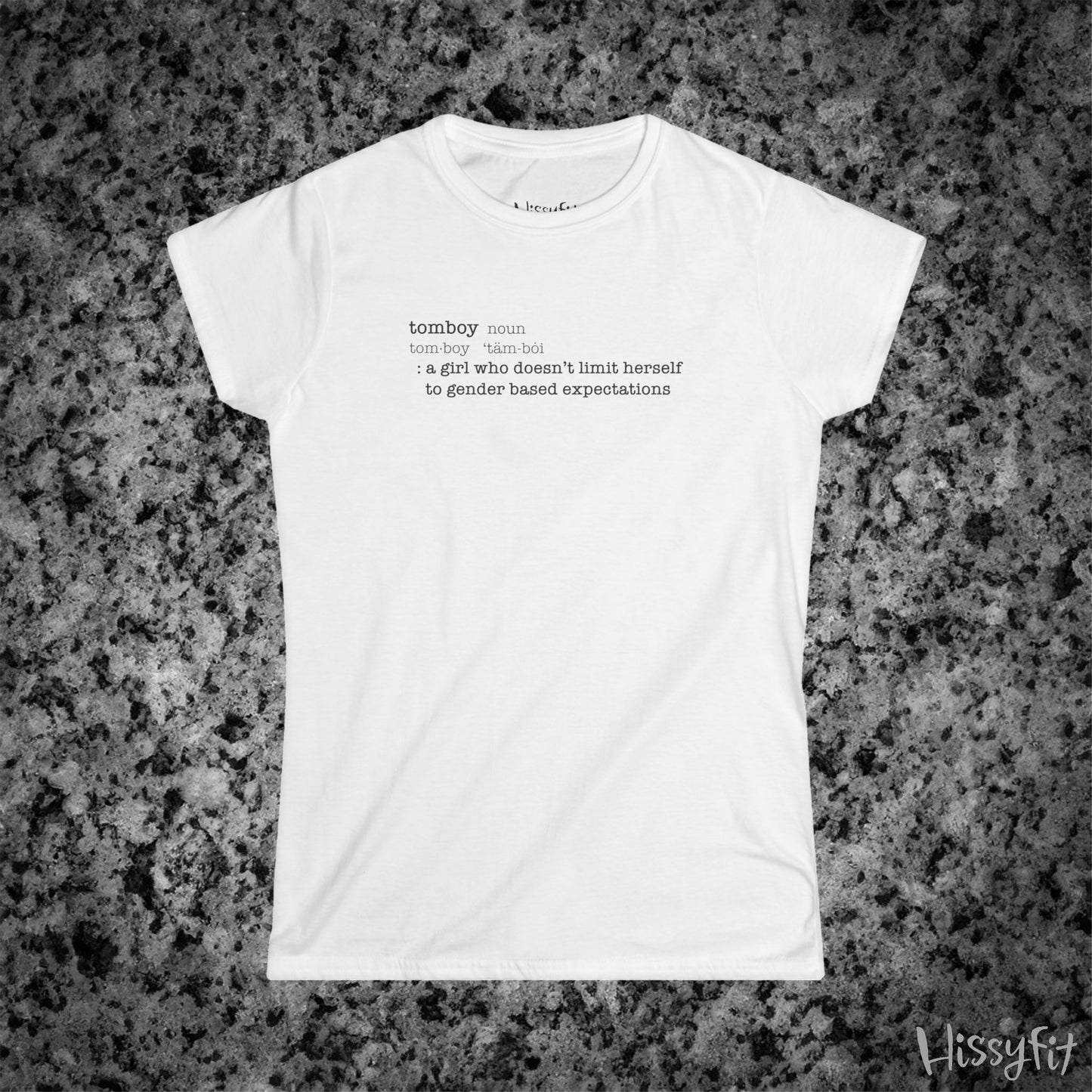 White t-shirt with text 'Tomboy:definition' on a gray granite surface, featuring the brand 'Hissyfit'.