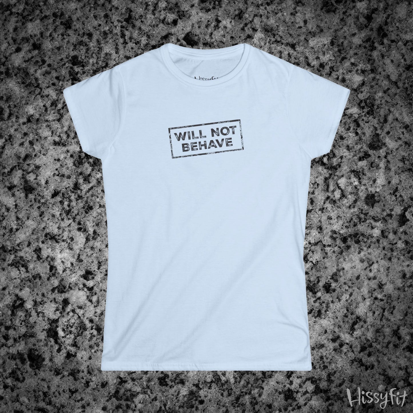 Light Blue t-shirt with 'WILL NOT BEHAVE' text on a gray granite surface, brand 'Hissyfit' visible.