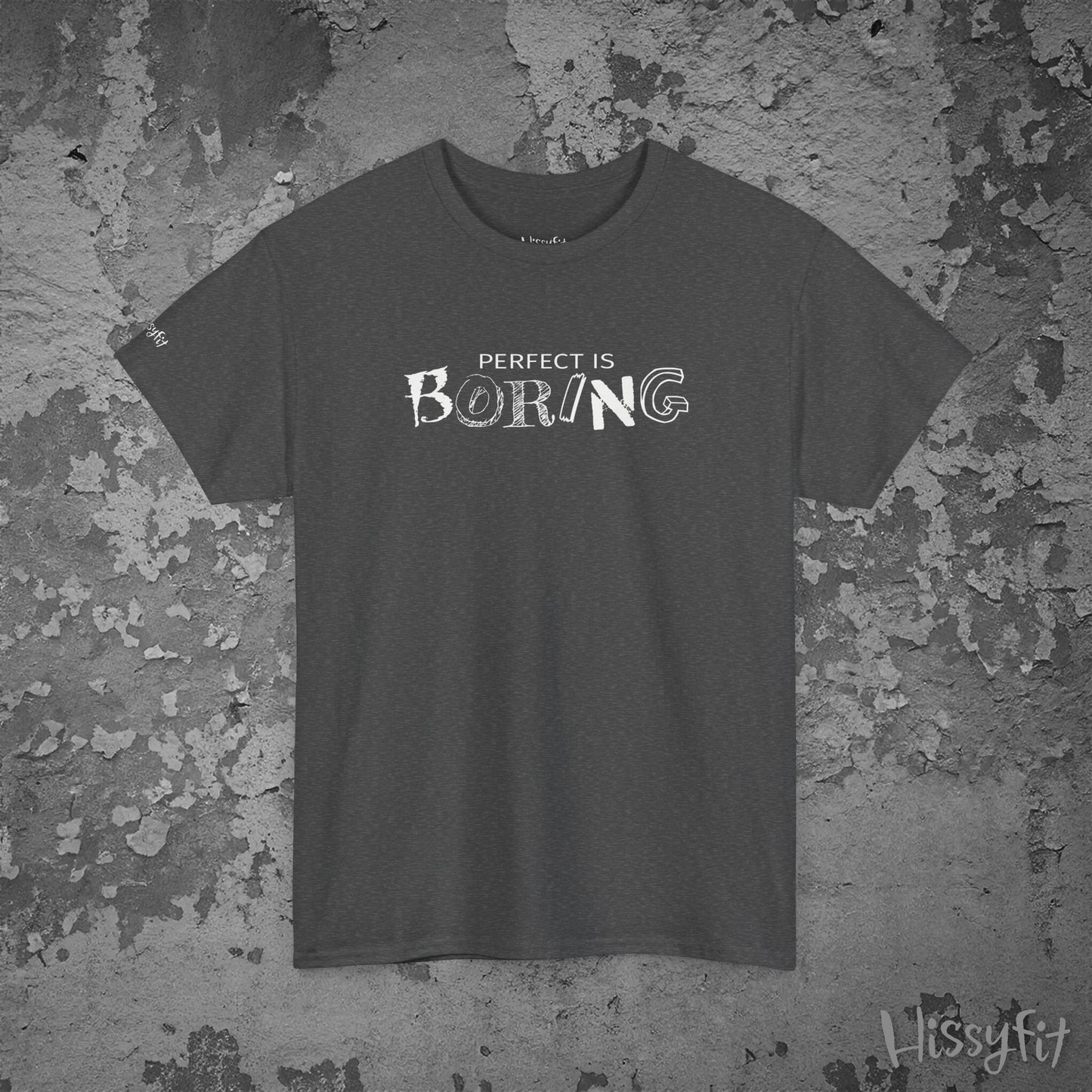 Gray t-shirt with 'Perfect is Boring' text on a textured gray background