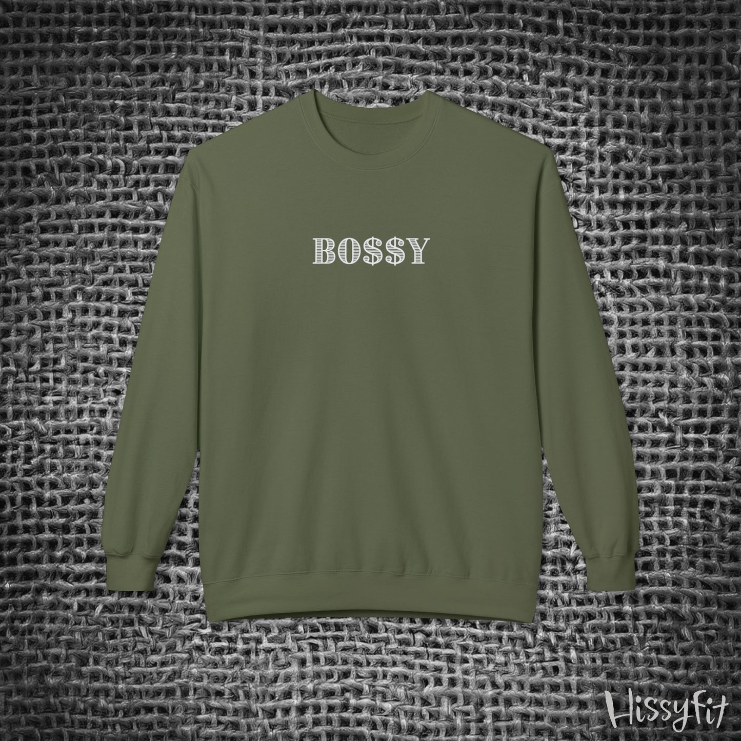 Green long-sleeve shirt with 'BOSSY' text on a textured gray background