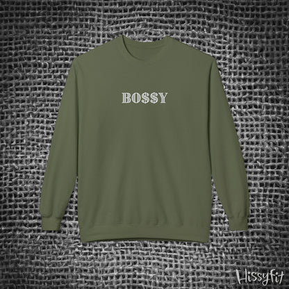Green long-sleeve shirt with 'BOSSY' text on a textured gray background