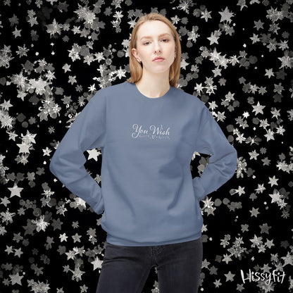 Person wearing a blue sweatshirt with 'You Wish' text against a star-patterned background