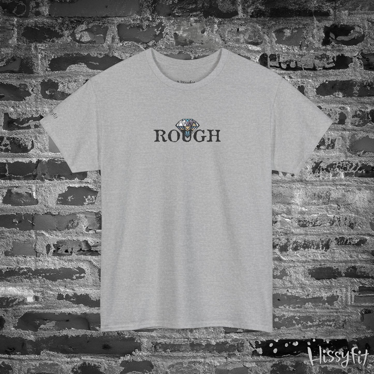 Gray t-shirt with 'ROUGH' text and diamond graphic on a brick wall background