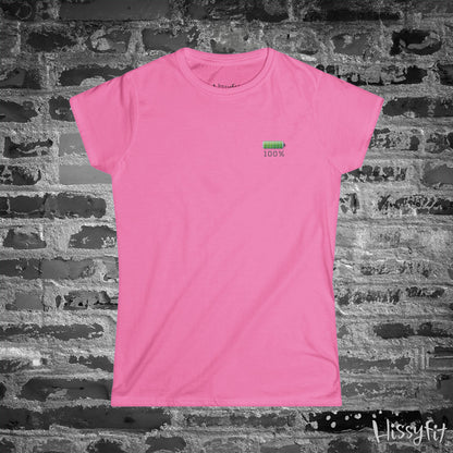 Pink t-shirt with a green battery symbol and '100%' charged on a brick wall background