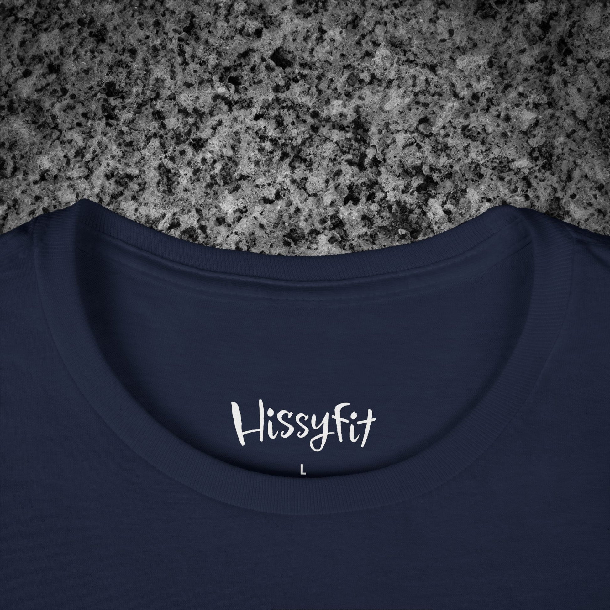 Navy blue t-shirt with 'Hissyfit' logo on a gray granite surface