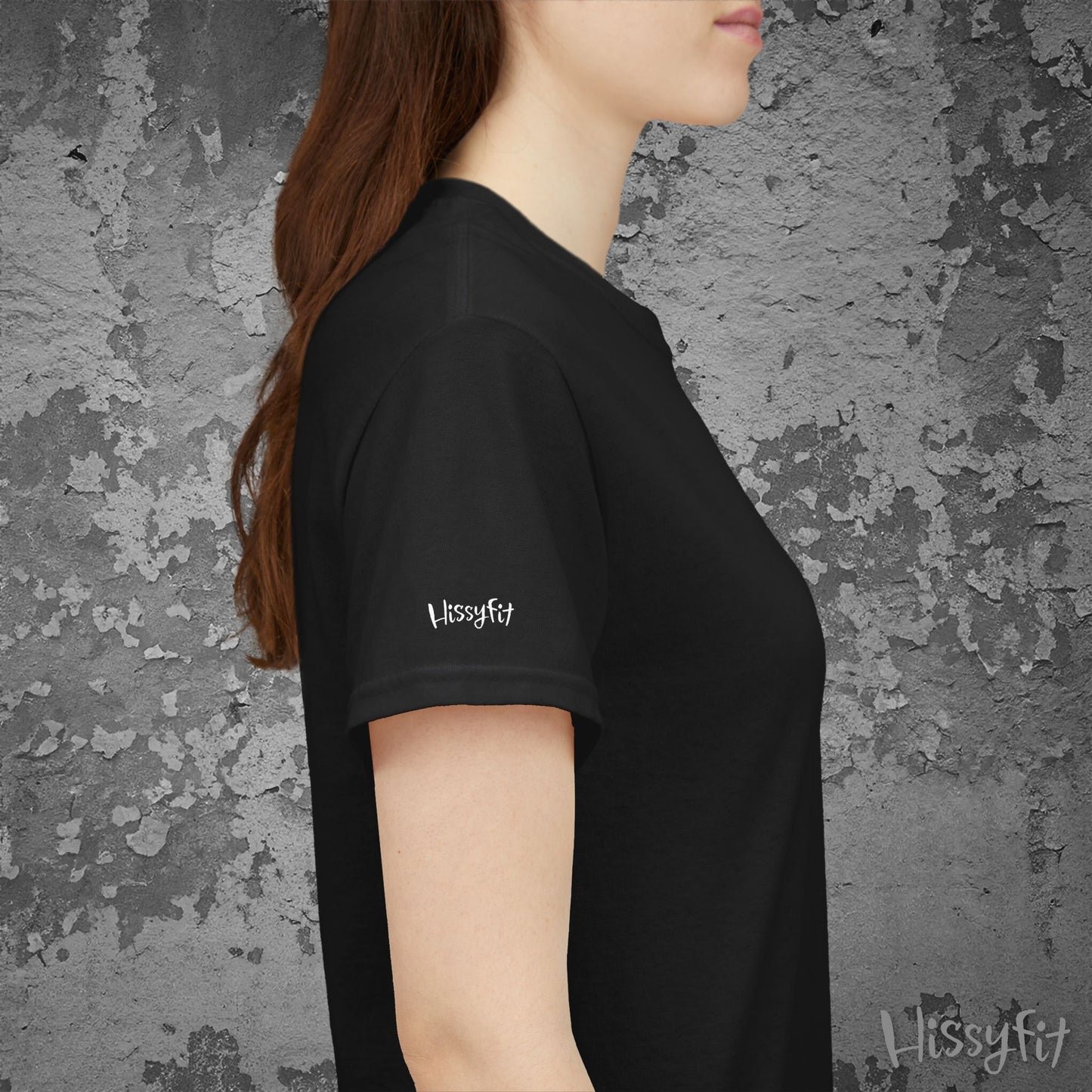 Person wearing a black t-shirt with 'Hissyfit' logo against a textured gray background