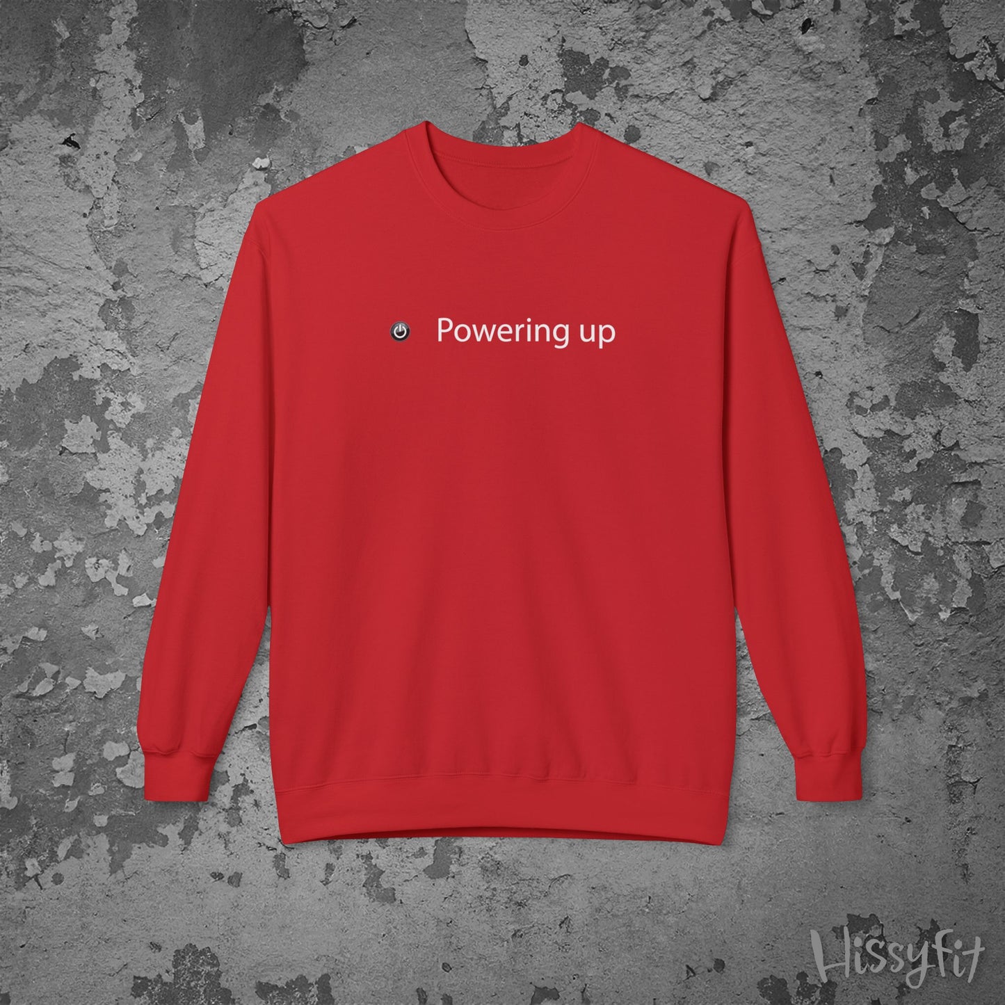 Red sweatshirt with 'Powering up' text on a textured gray background
