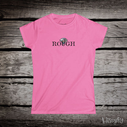 Pink t-shirt with a graphic diamond in 'Rough' text on a wooden surface, featuring the brand 'Hissyfit'.