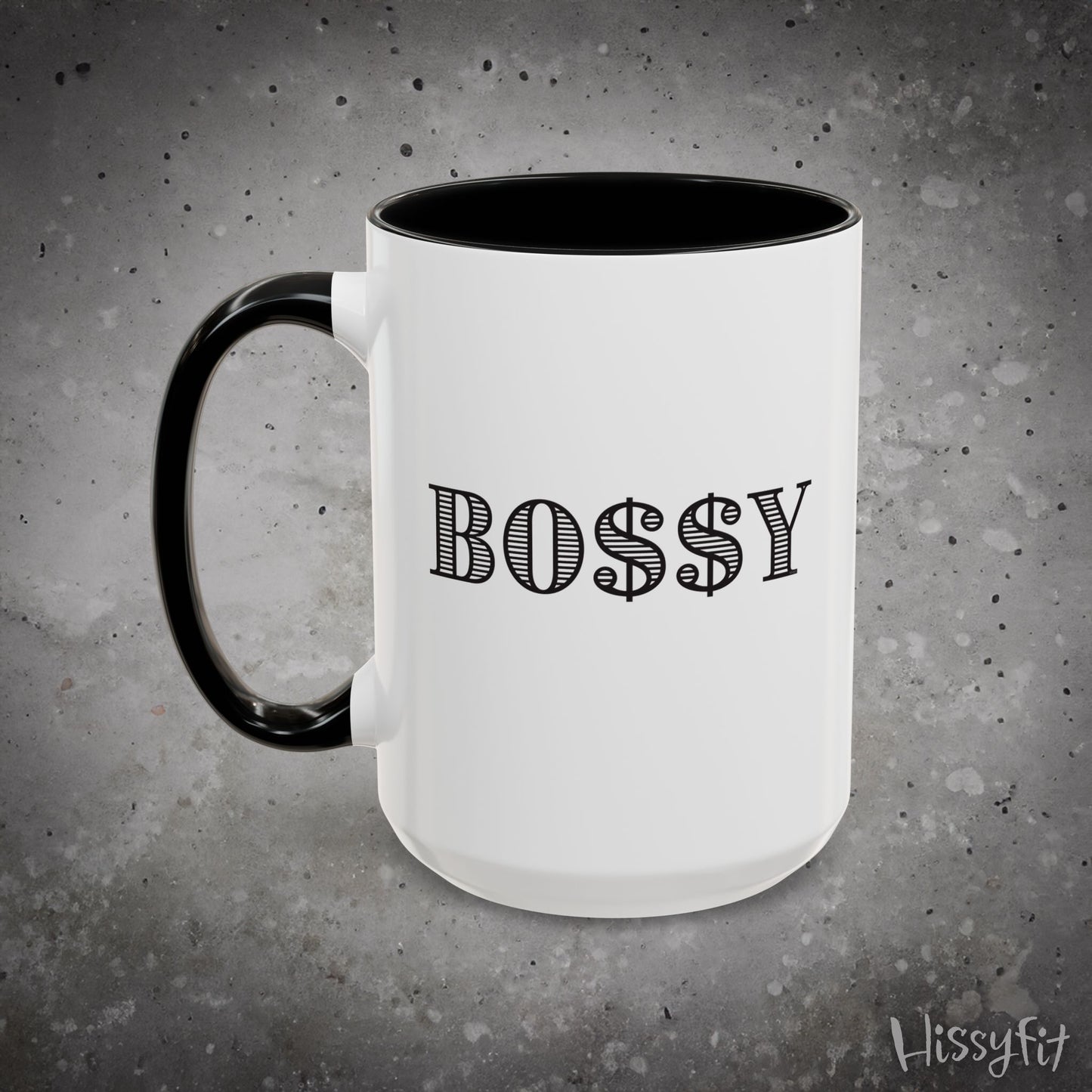 White mug with black handle and 'BOSSY' text on a gray background