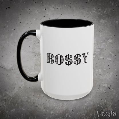 White mug with black handle and 'BOSSY' text on a gray background