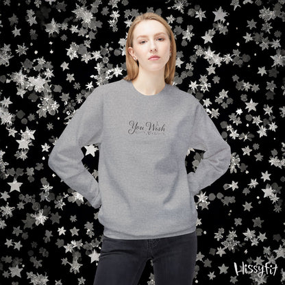 Person wearing a gray sweatshirt with 'You Wish' text against a star-patterned background