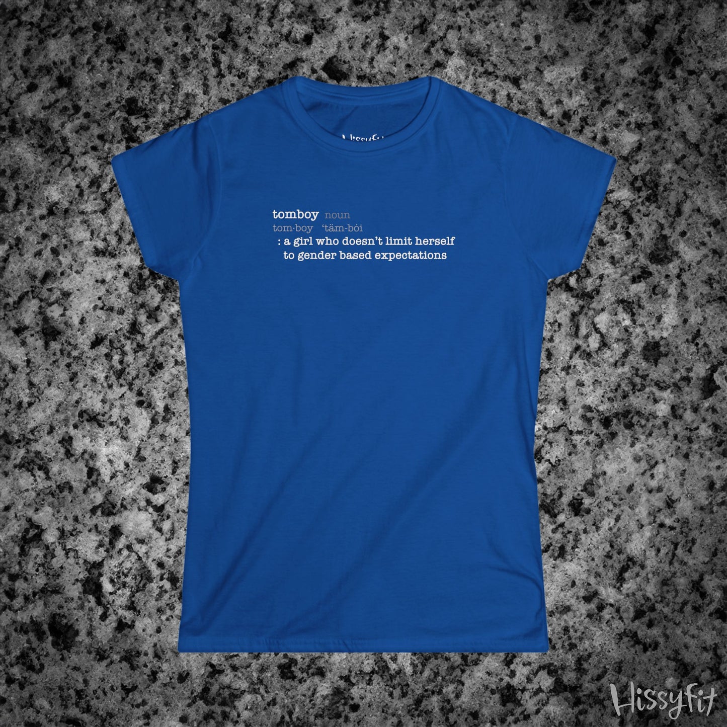 Blue t-shirt with text 'Tomboy:definition' on a gray granite surface, featuring the brand 'Hissyfit'.
