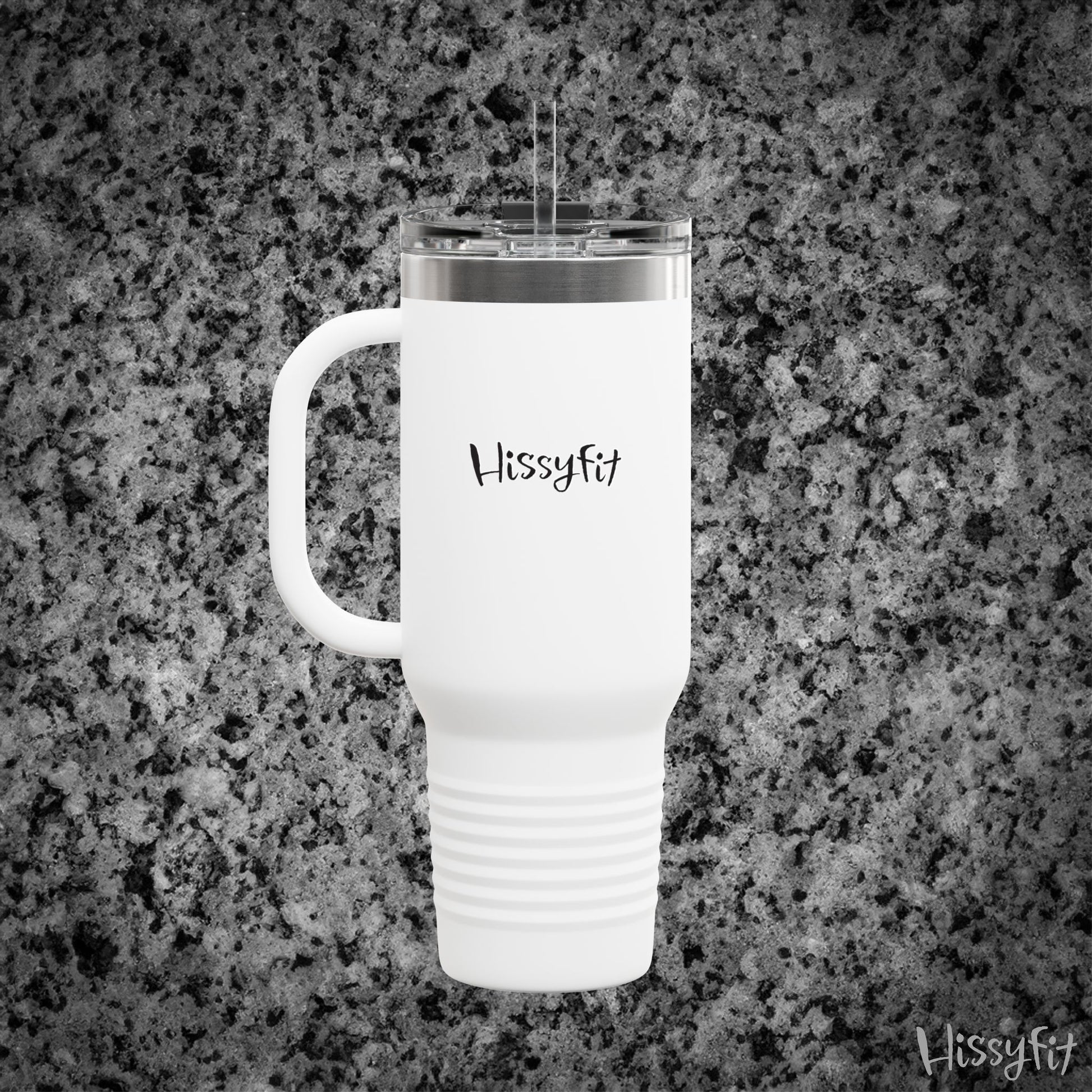 White travel mug with 'Hissyfit' branding on a gray granite surface