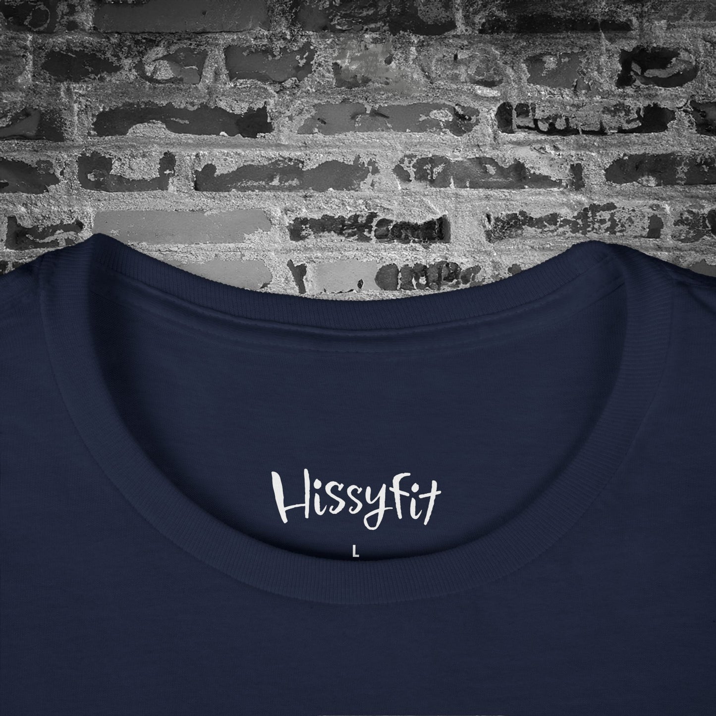 Navy blue shirt with 'Hissyfit' text on a brick wall background
