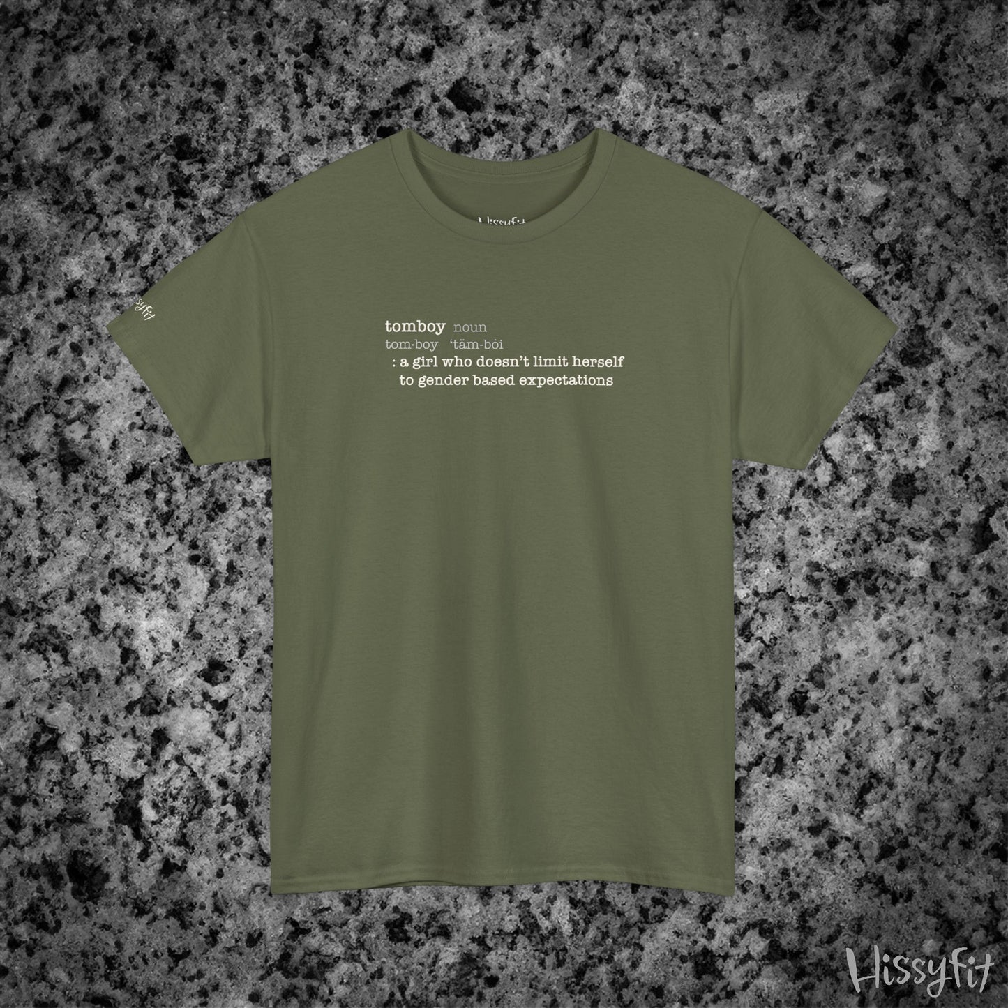 Green t-shirt with text 'Tomboy:definition' on a gray and black speckled background