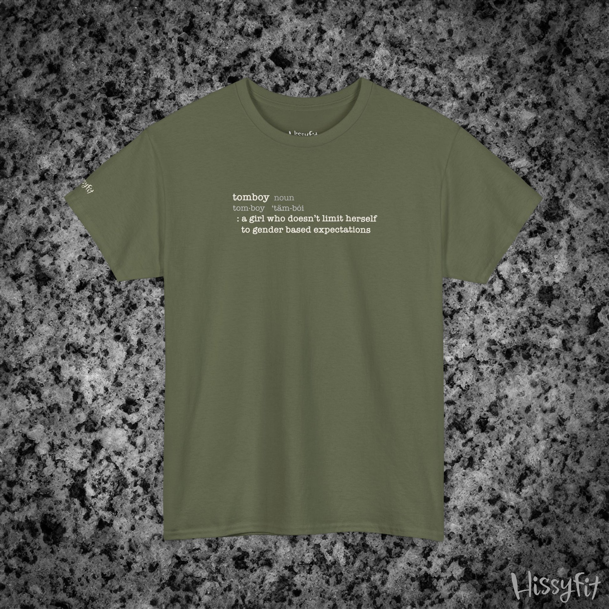 Green t-shirt with text 'Tomboy:definition' on a gray and black speckled background