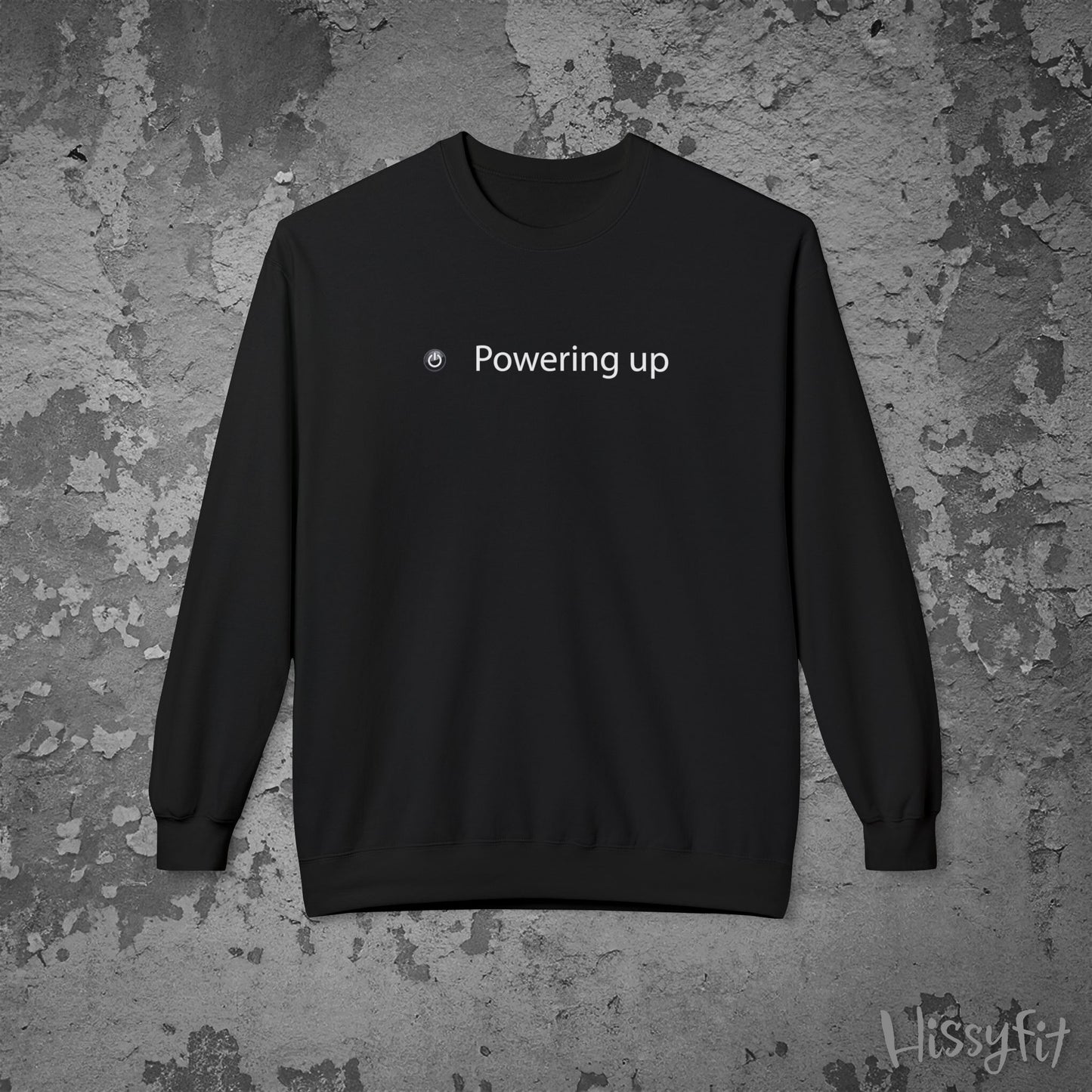 Black sweatshirt with 'Powering up' text on a textured gray background