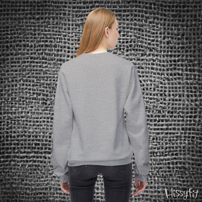 Person wearing a gray sweater standing against a textured gray wall with 'Hissyfit' branding.