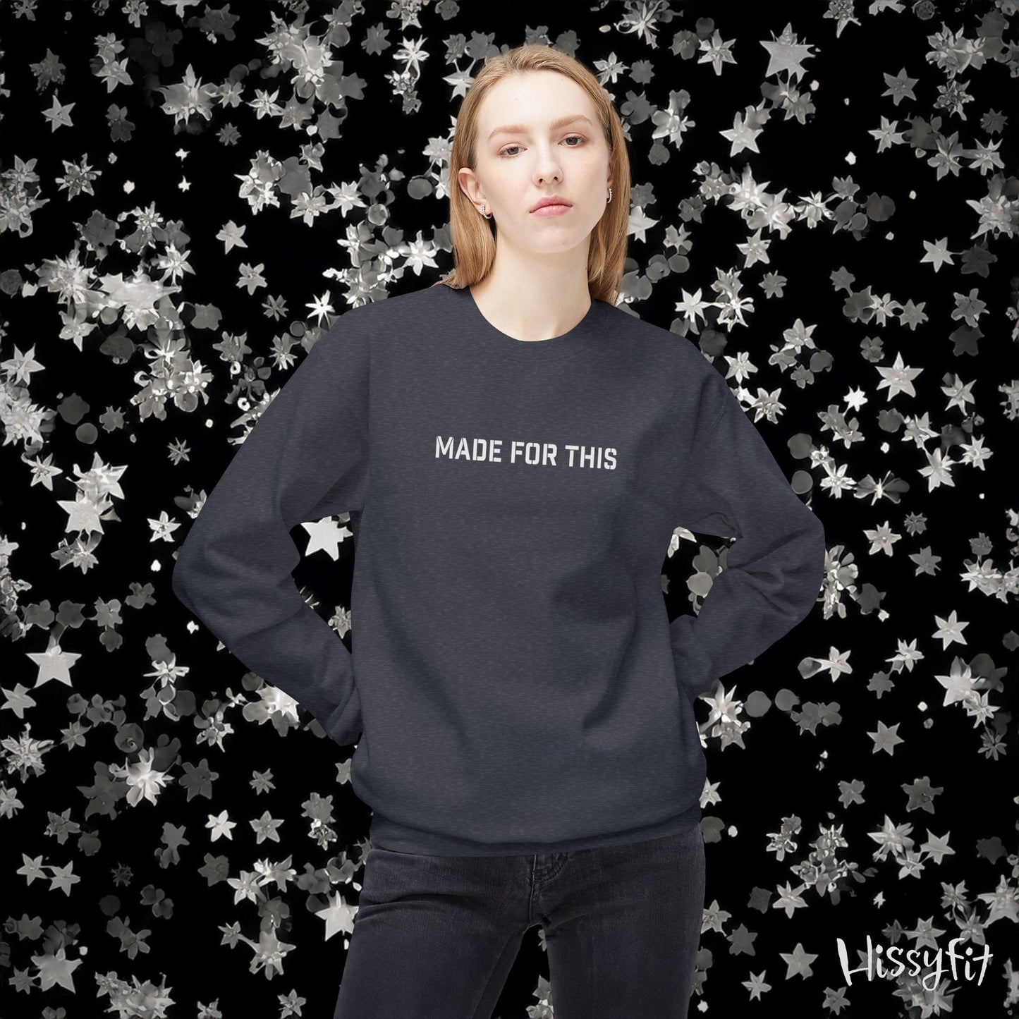 Person wearing a dark gray sweatshirt with 'MADE FOR THIS' text against a star-patterned background