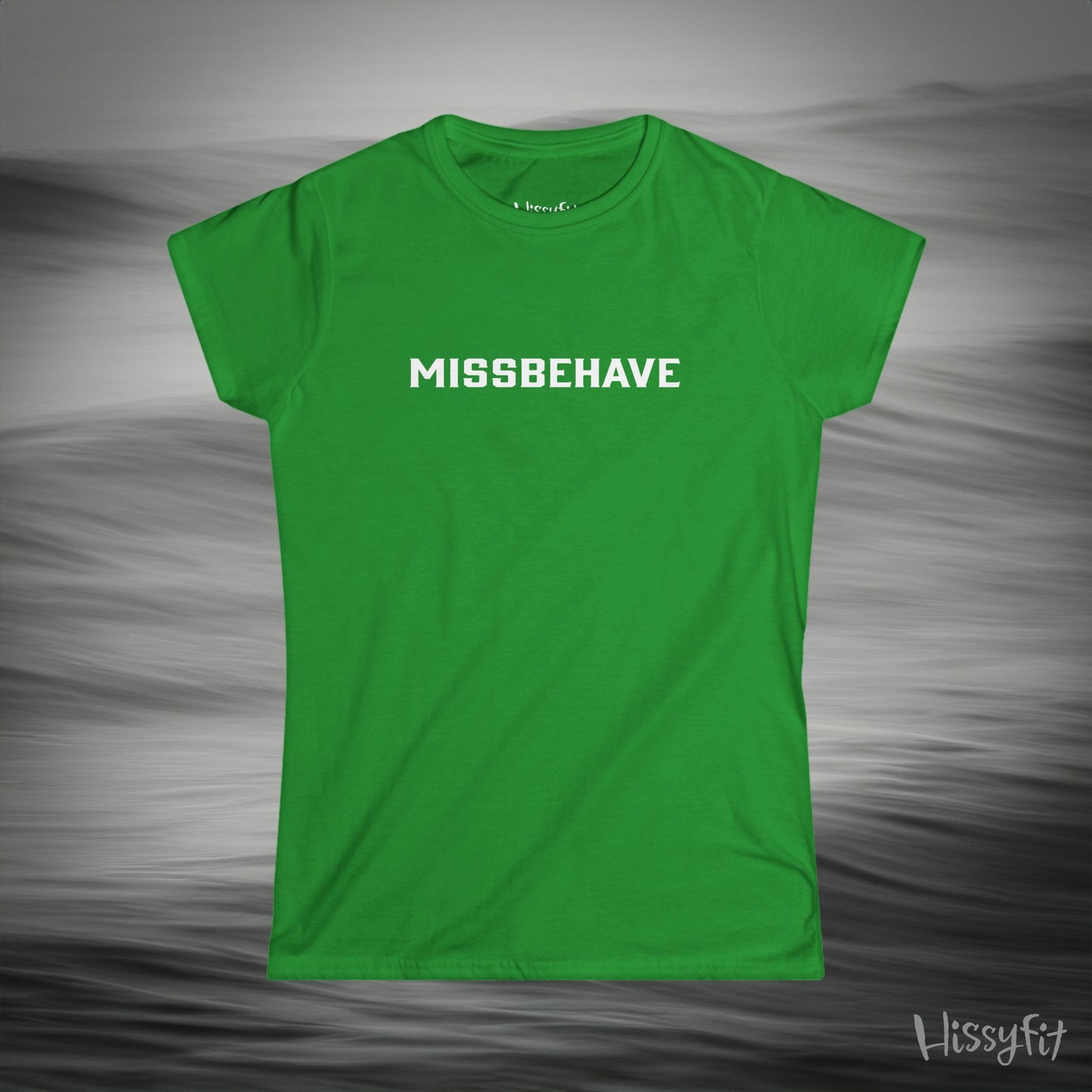 Green t-shirt with 'MISSBEHAVE' text on a gray background