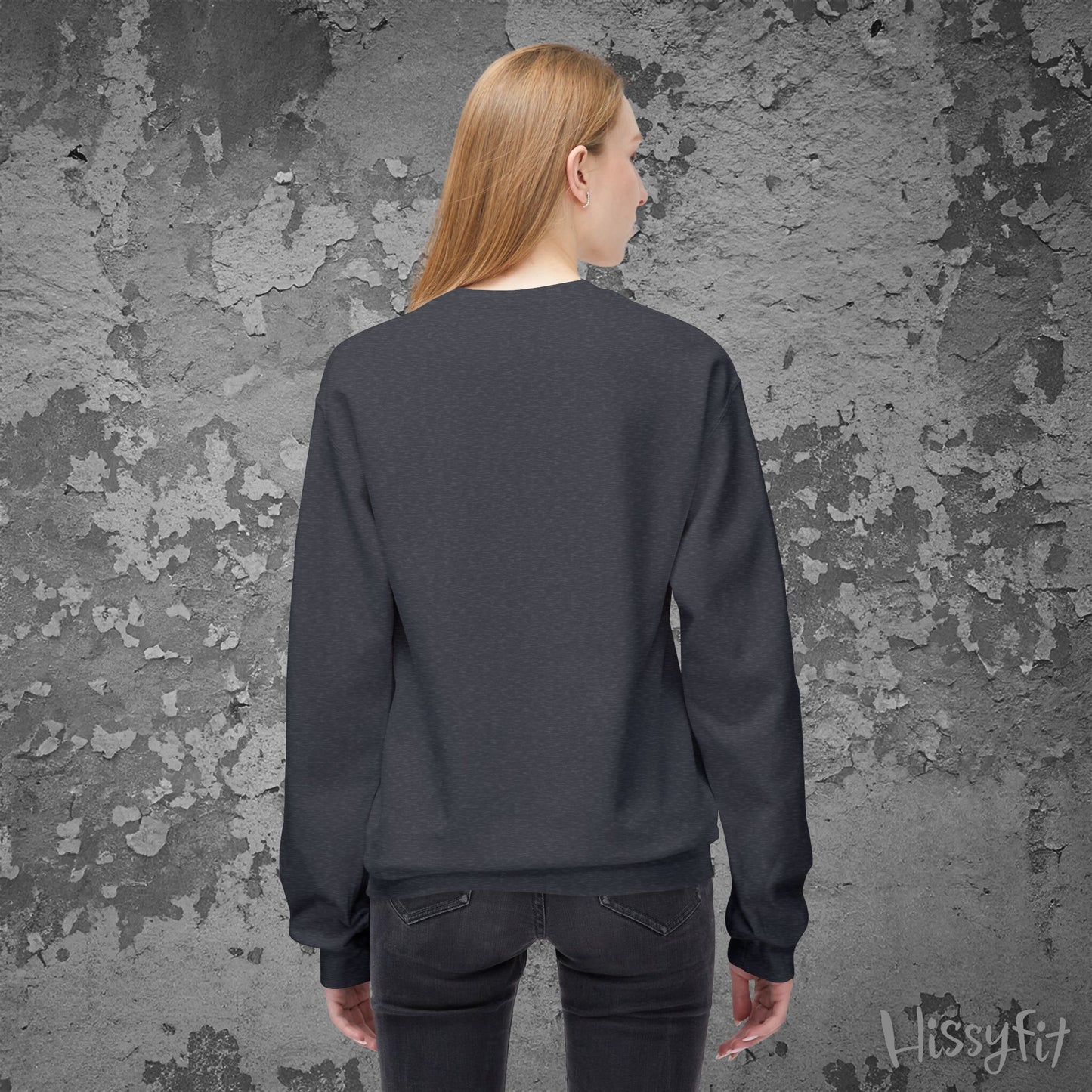 Person wearing a dark gray sweatshirt against a textured gray wall with 'Hissyfit' branding.
