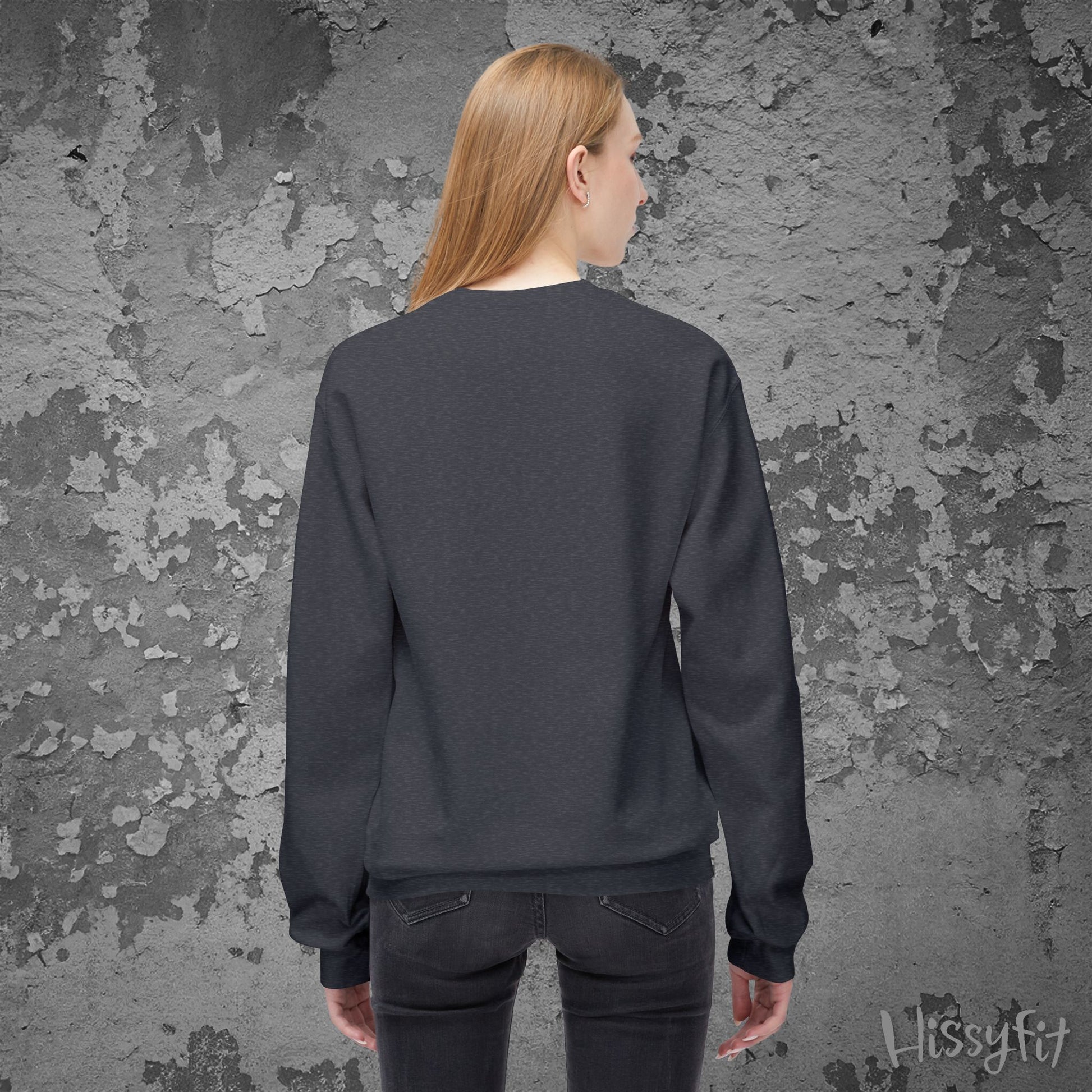 Person wearing a dark gray sweatshirt against a textured gray wall with 'Hissyfit' branding.