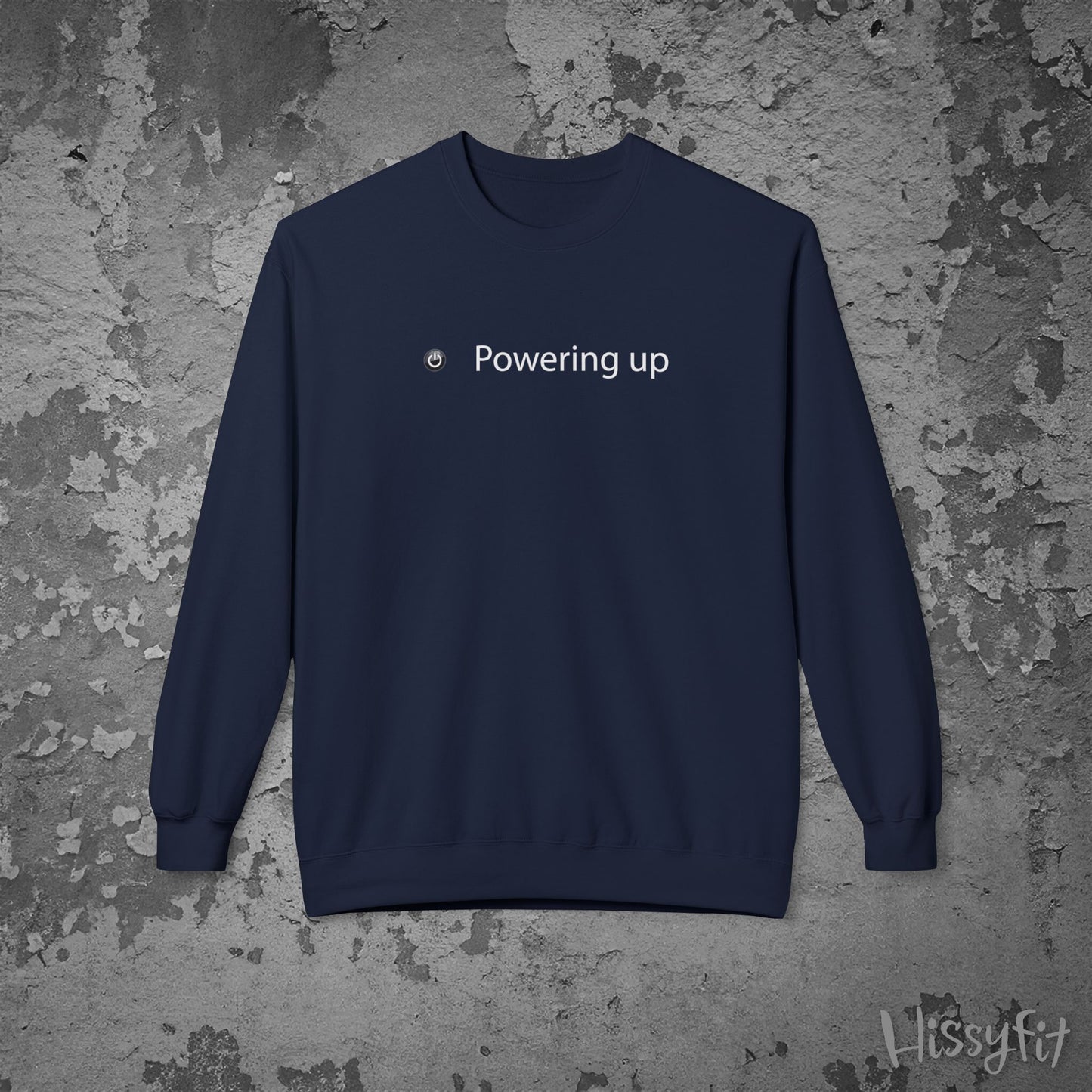 Navy blue sweatshirt with 'Powering up' text on a textured gray background