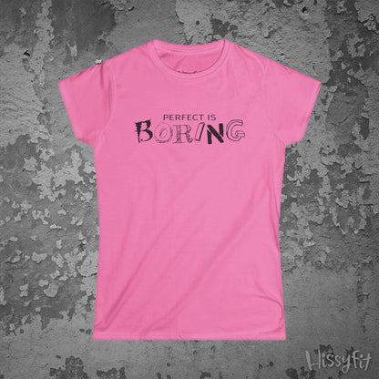 Pink t-shirt with 'PERFECT IS BORING' text on a textured gray background