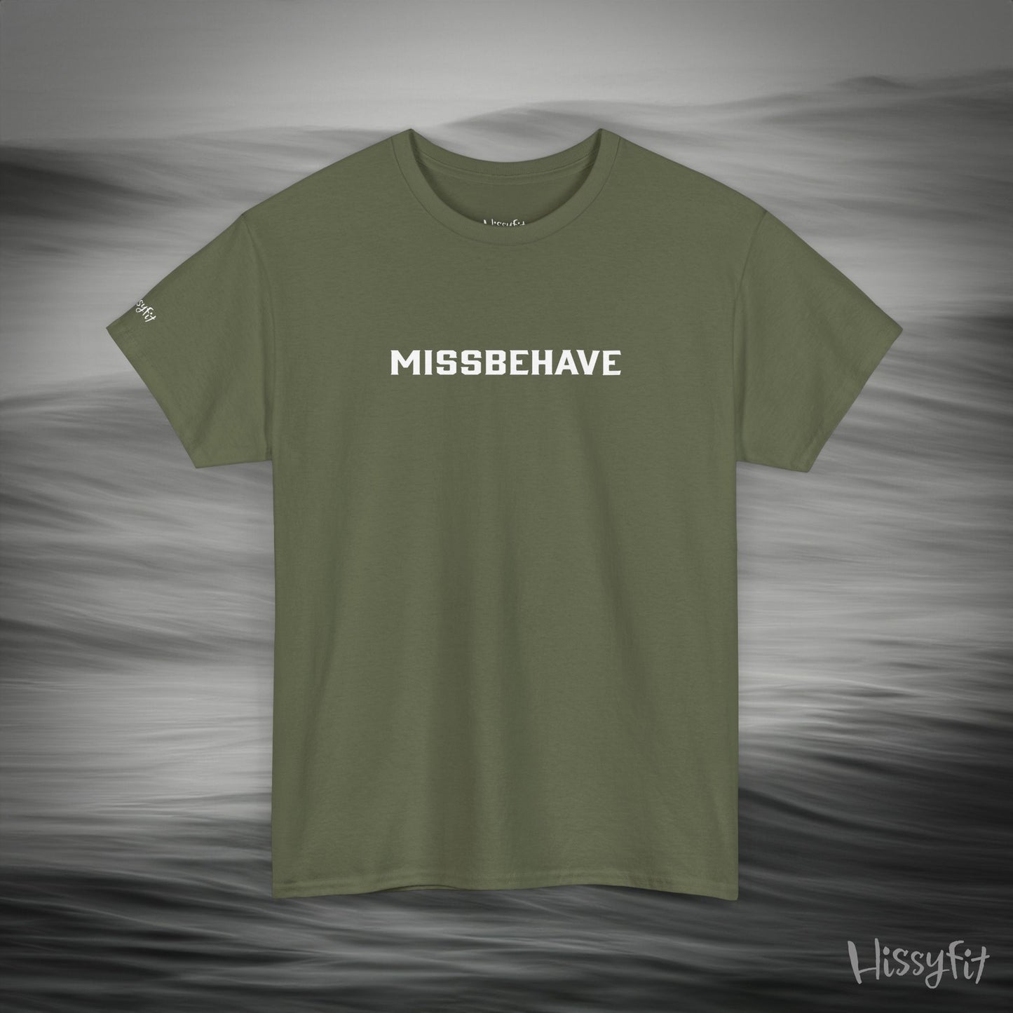 Green t-shirt with 'MISSBEHAVE' text on a gray background