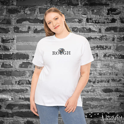 Person wearing a white t-shirt with a diamond graphic and 'ROUGH' text against a textured wall.