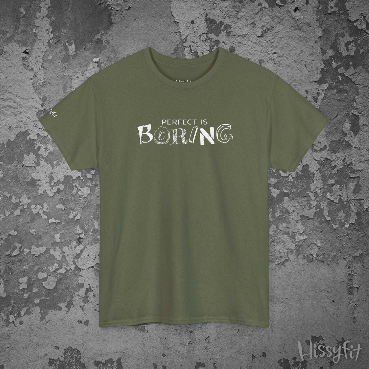 Green t-shirt with 'PERFECT IS BORING' text on a textured gray background