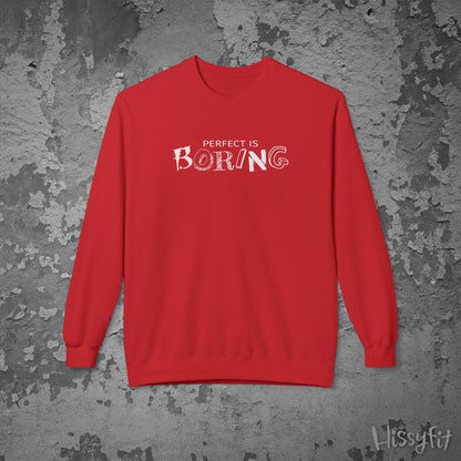 Red sweatshirt with 'PERFECT IS BORING' text on a textured gray background