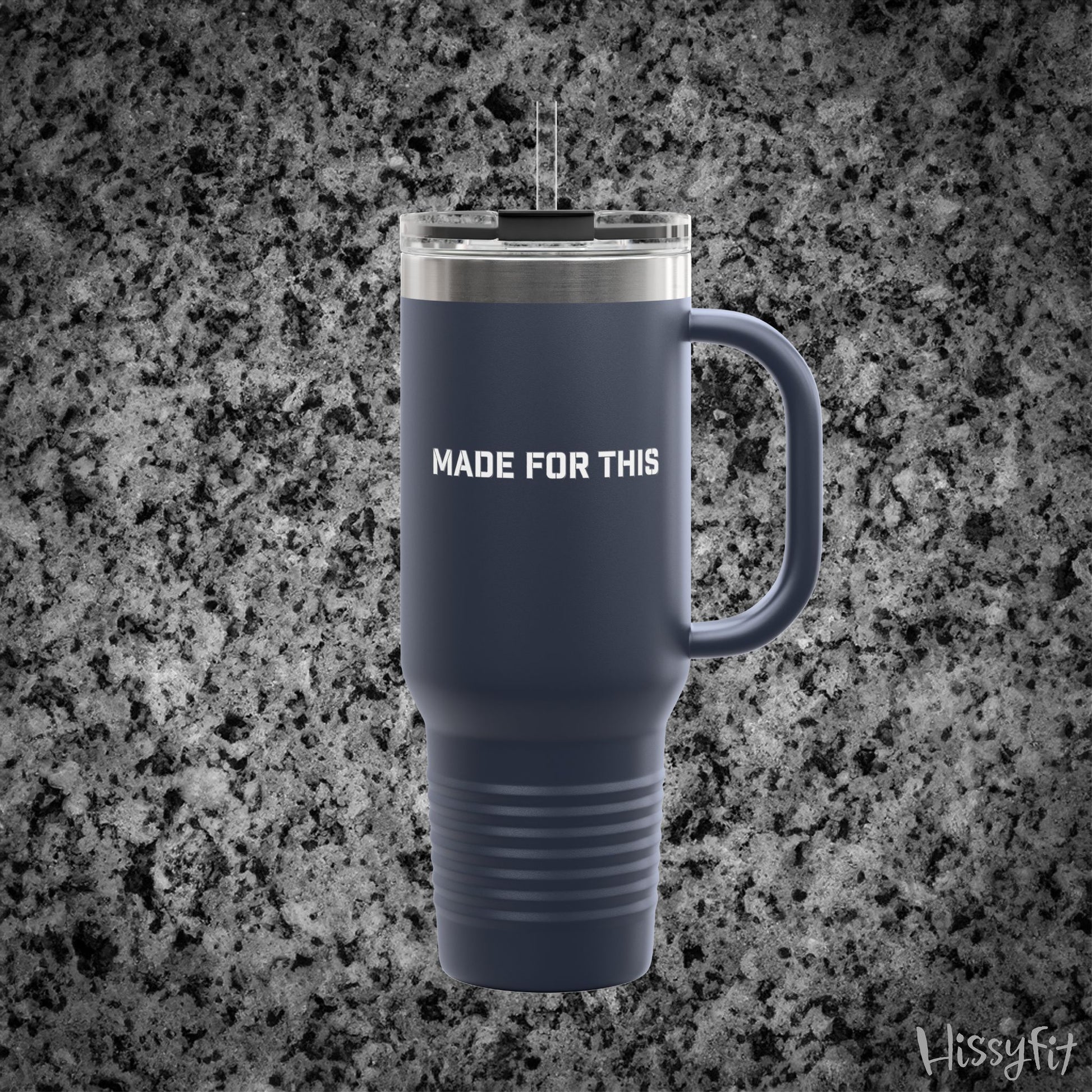 Navy blue travel mug with 'MADE FOR THIS' text on a gray granite background