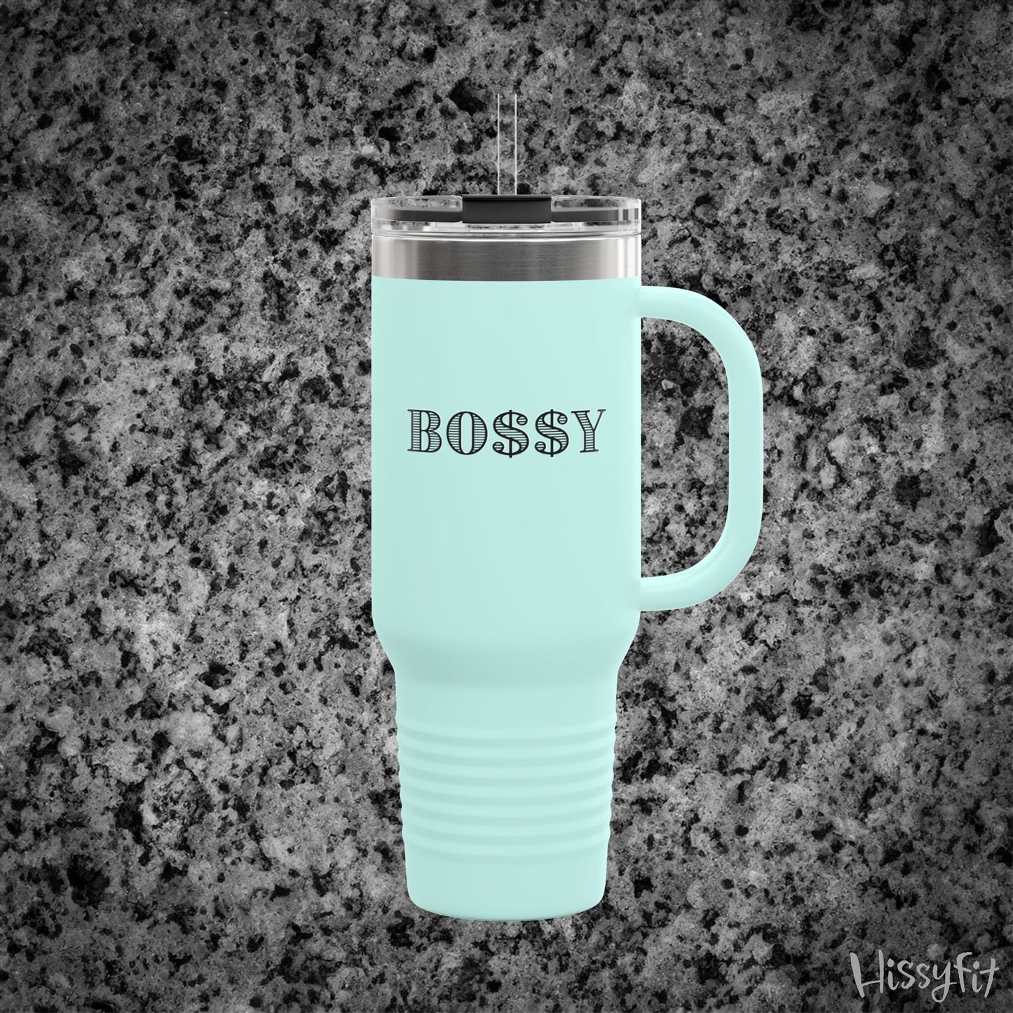 Light blue travel mug with 'BOSSY' text on a gray granite background