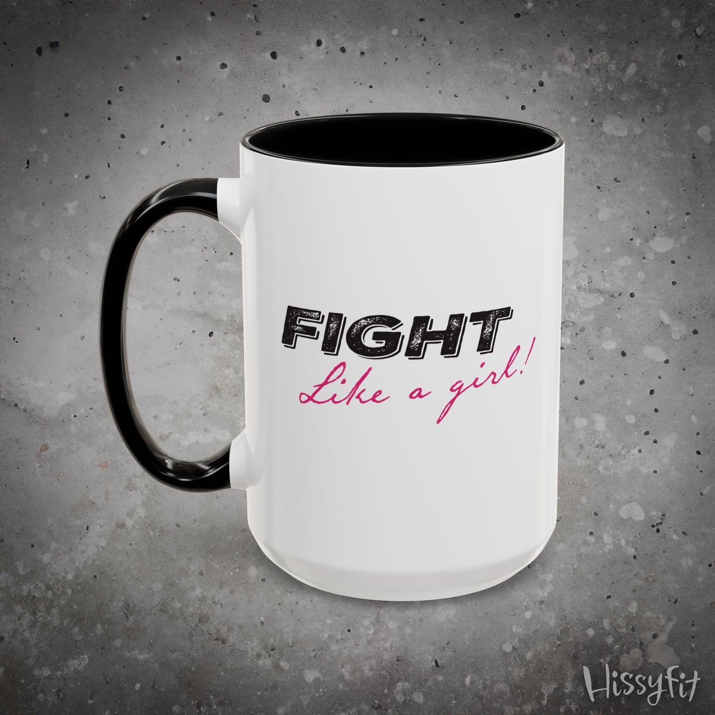 Mug with 'Fight Like a Girl' text on a gray background