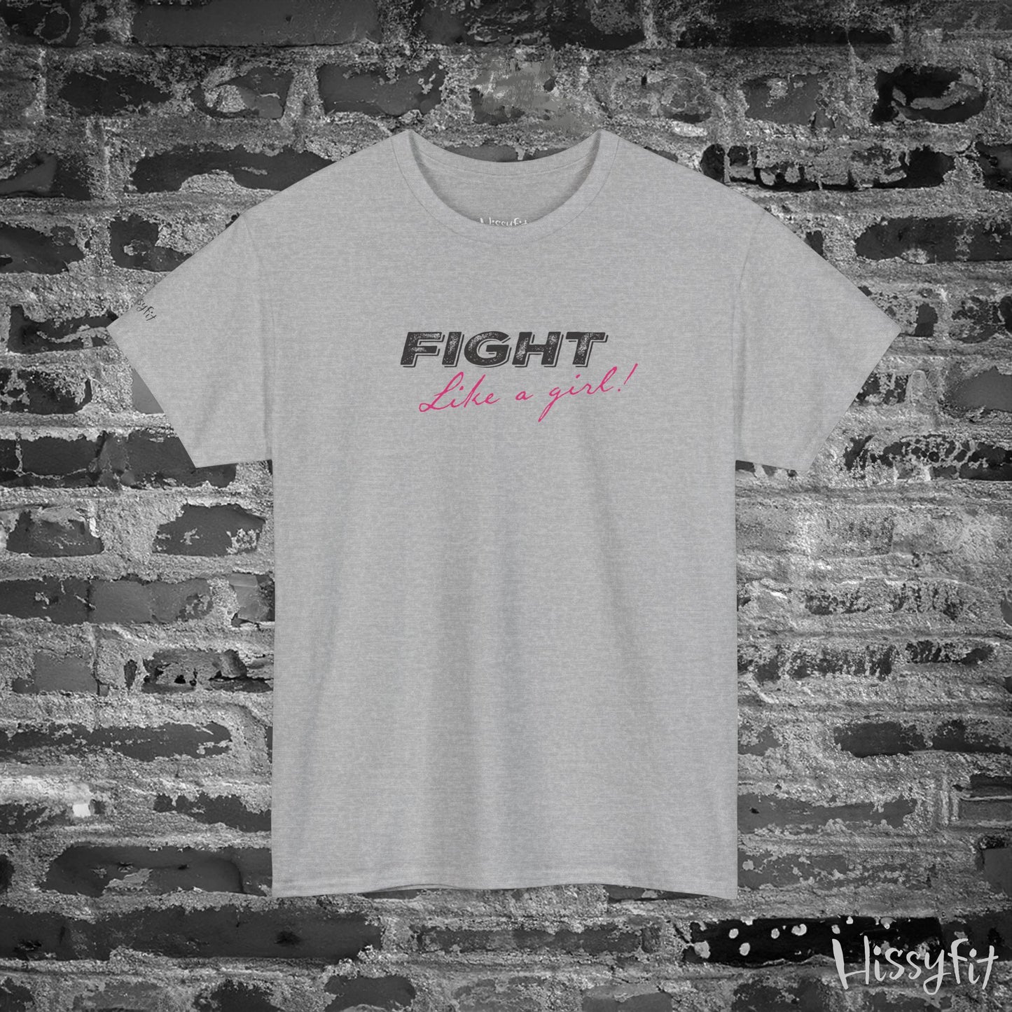 Gray t-shirt with 'Fight Like a Girl' text on a brick wall background