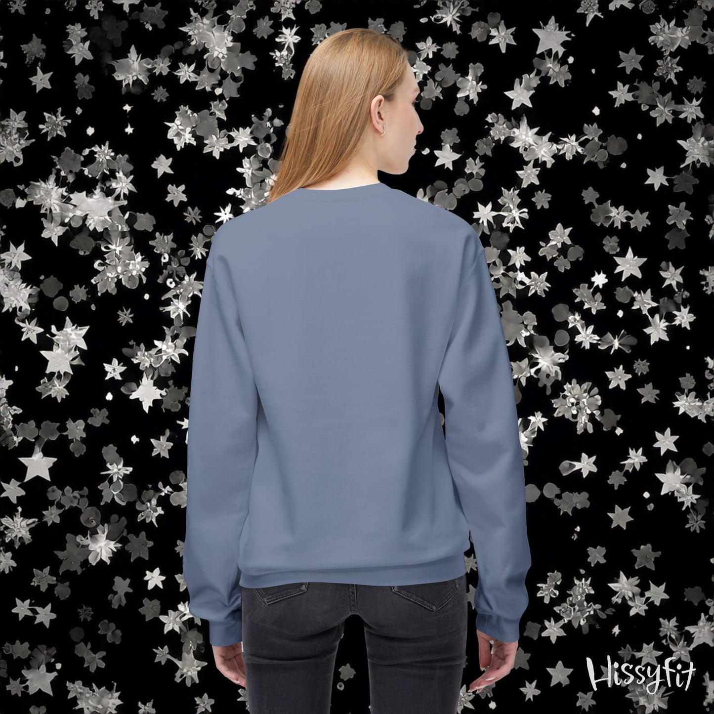 Person wearing a blue sweatshirt with a starry patterned background