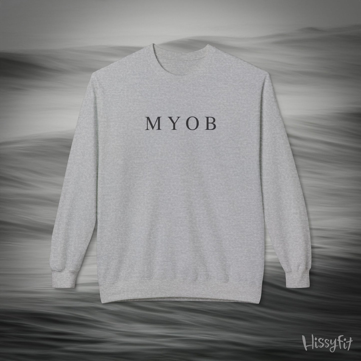 Gray sweatshirt with 'MYOB' text on a gray background