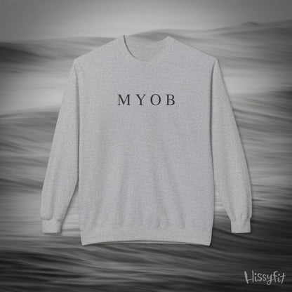 Gray sweatshirt with 'MYOB' text on a gray background