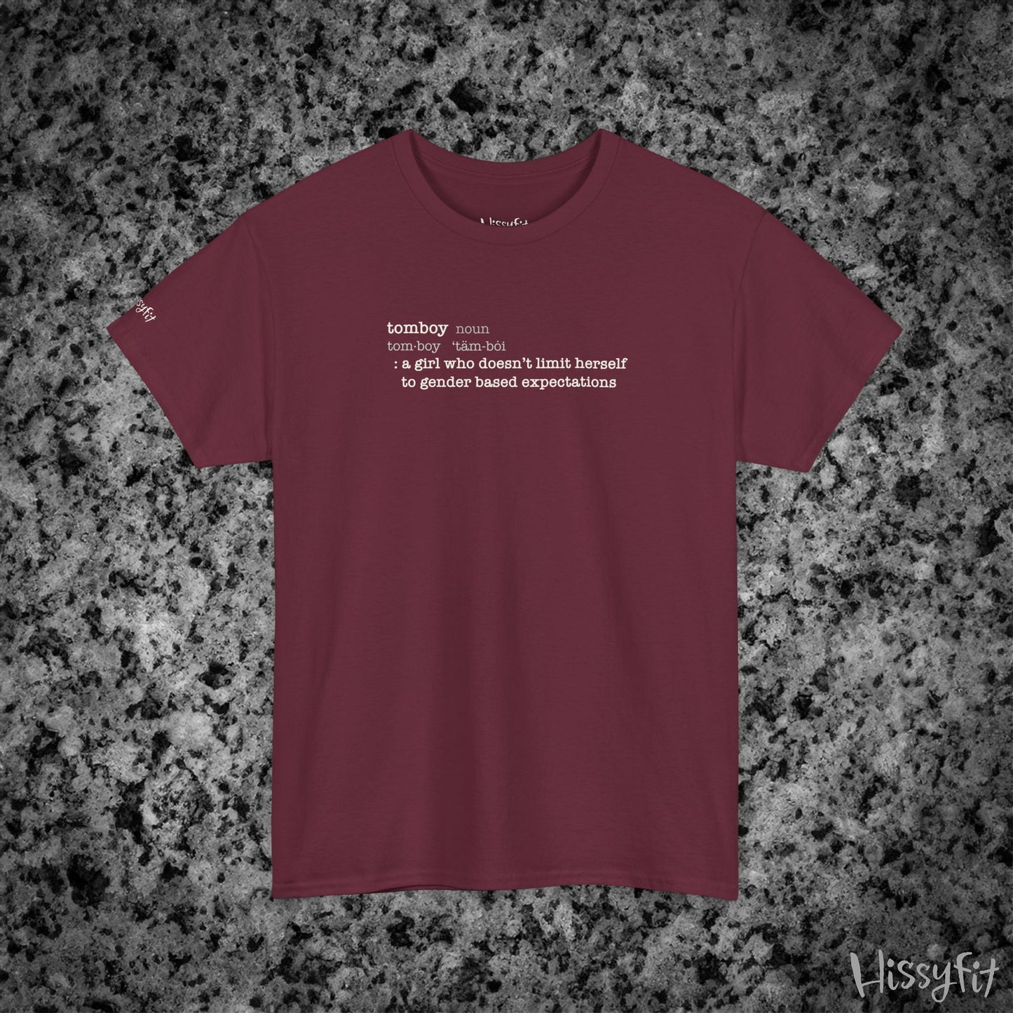 Maroon t-shirt with text 'Tomboy:definition' on a gray and black speckled background, featuring the brand 'Hissyfit'.