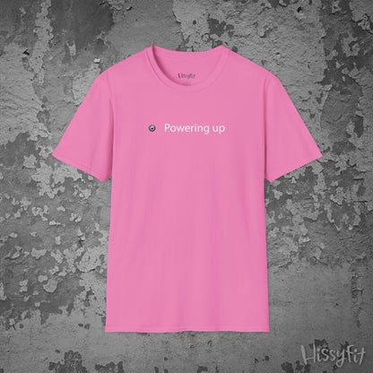 Pink t-shirt with 'Powering up' text on a textured gray background