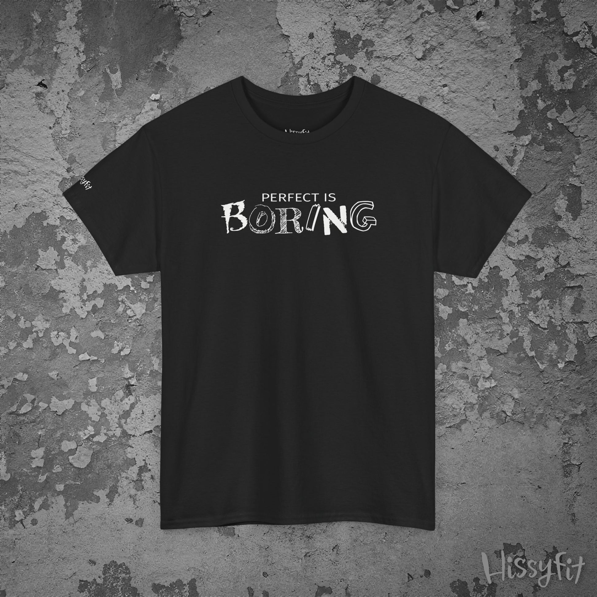 Black t-shirt with 'PERFECT IS BORING' text on a textured gray background