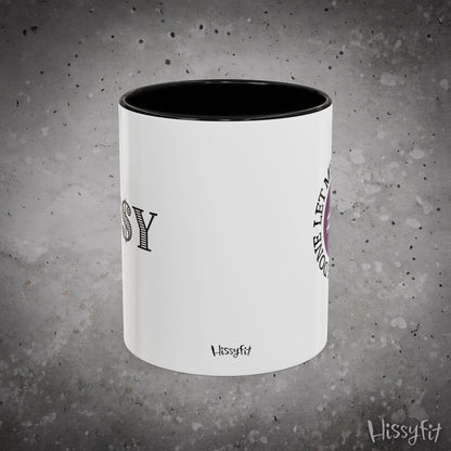 White mug with black interior on a gray textured background, featuring 'Hissyfit' branding.